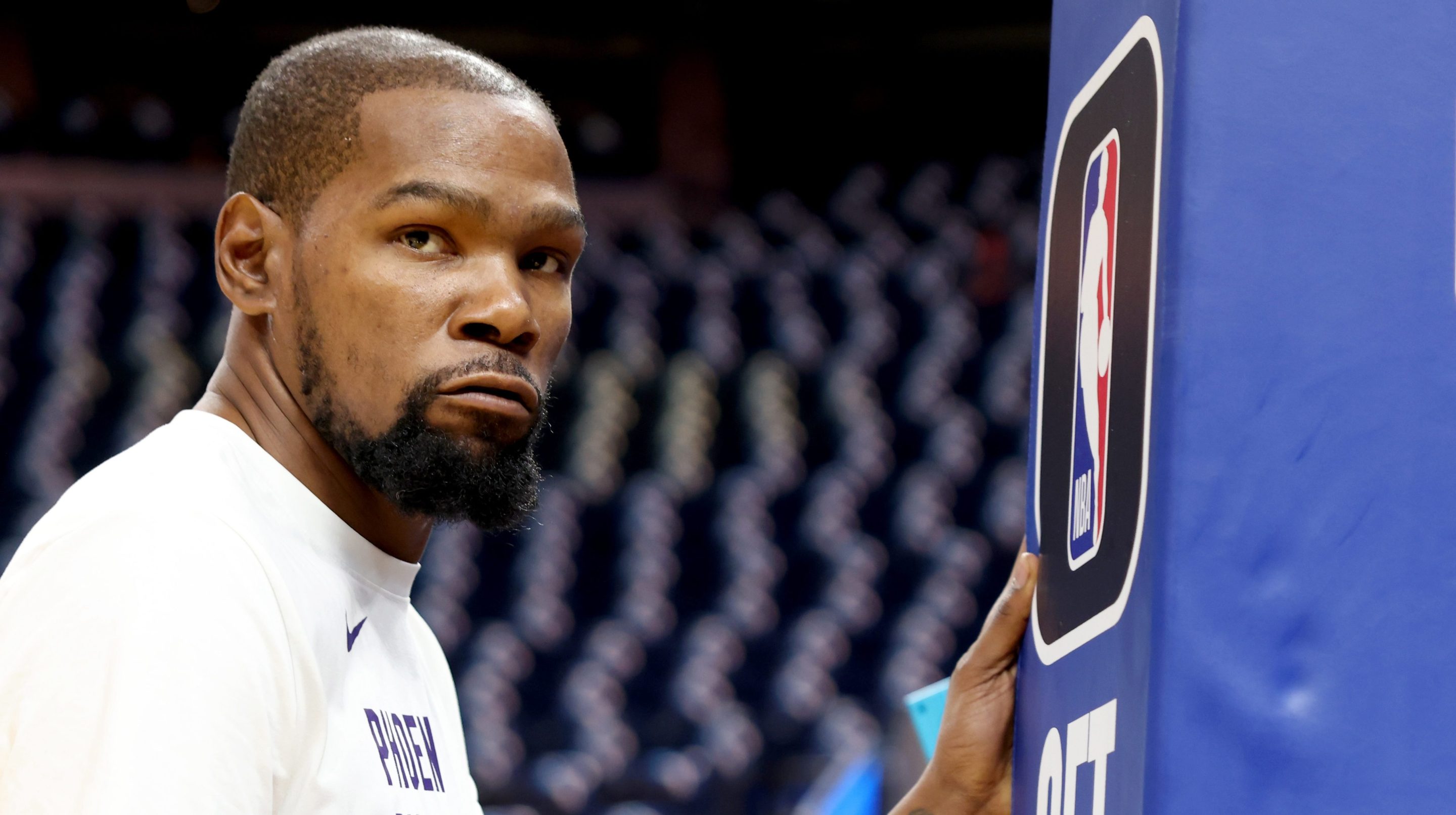 Phoenix Suns' Kevin Durant (35) stretches during warmups before their season opener against the Golden State Warriors at Chase Center in San Francisco, Calif., on Tuesday, Oct. 24, 2023.