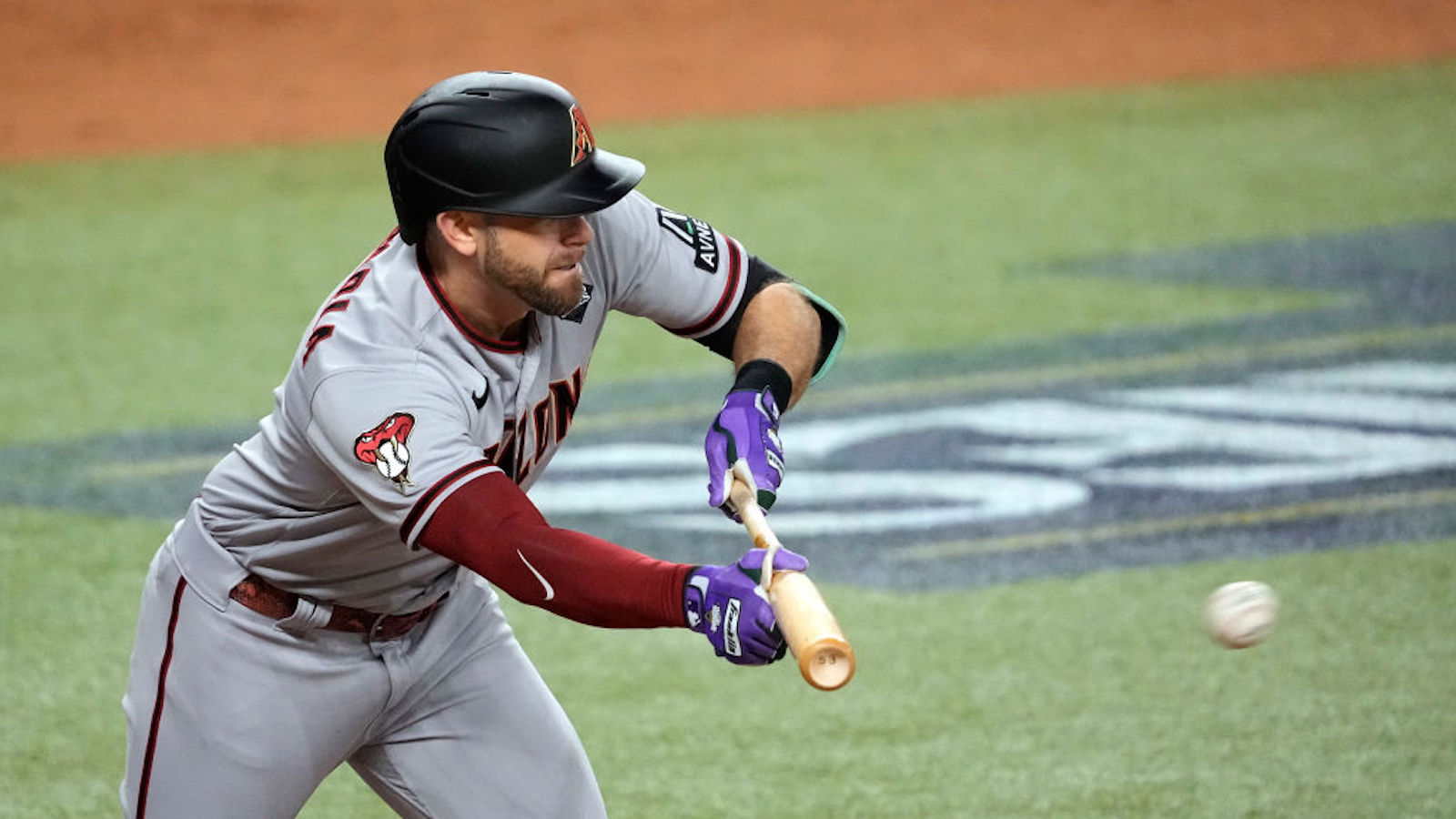 Evan Longoria #3 of the Arizona Diamondbacks attempts a bunt in the third inning against the Texas Rangers during Game Two of the World Series at Globe Life Field on October 28, 2023 in Arlington, Texas.