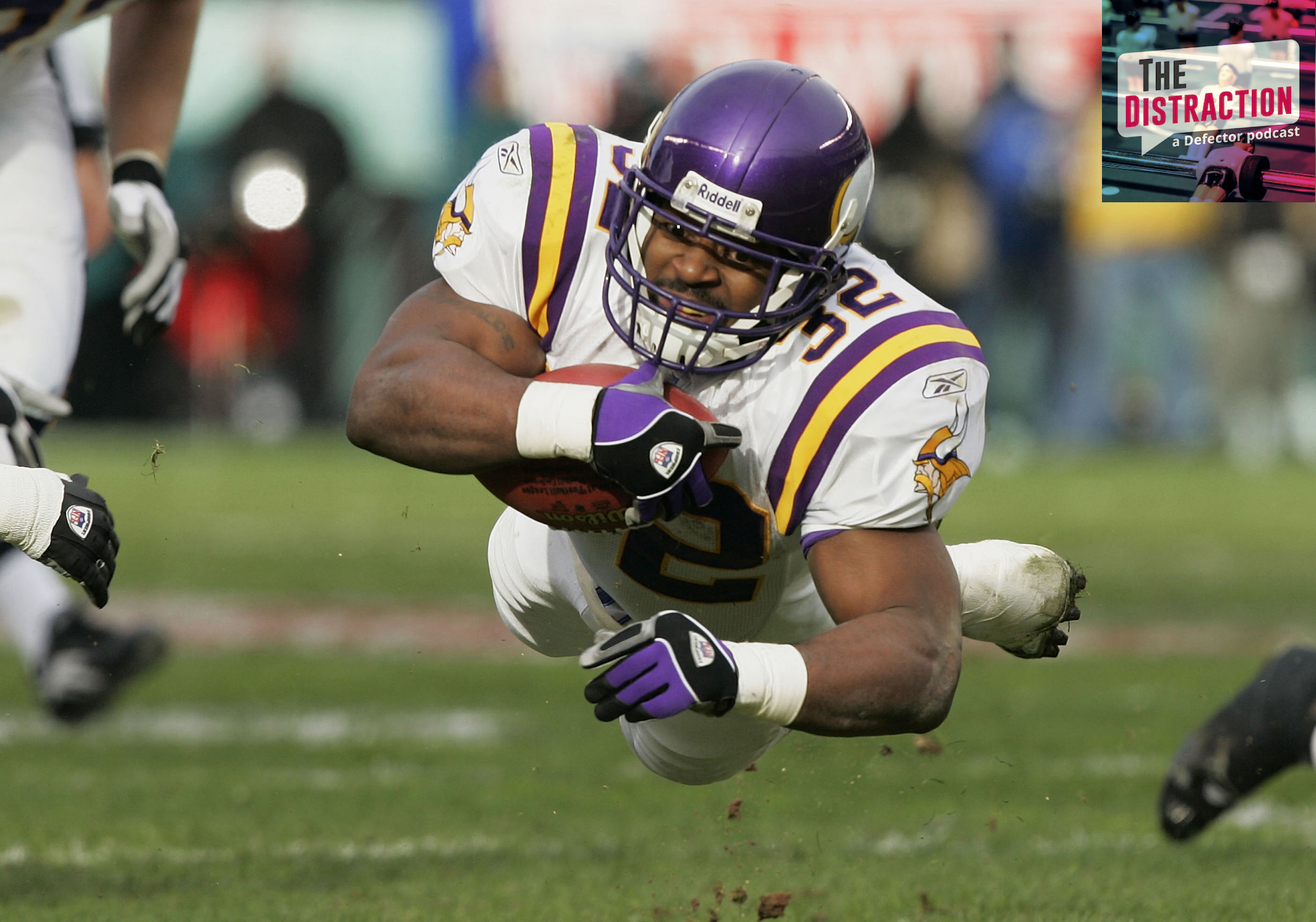 Onterrio Smith of the Minnesota Vikings diving for some extra yards in a NFL Playoff Game against the Eagles in January of 2005.