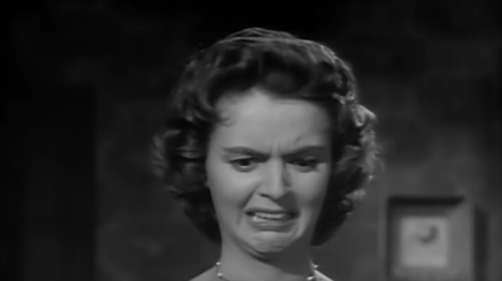 Actress Carolyn Craig looks disgusted and horrified, in the role of Nora Manning.