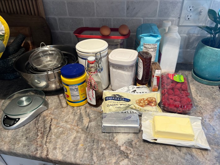 The ingredients for mini-cheesecakes organized on Chris's countertop.
