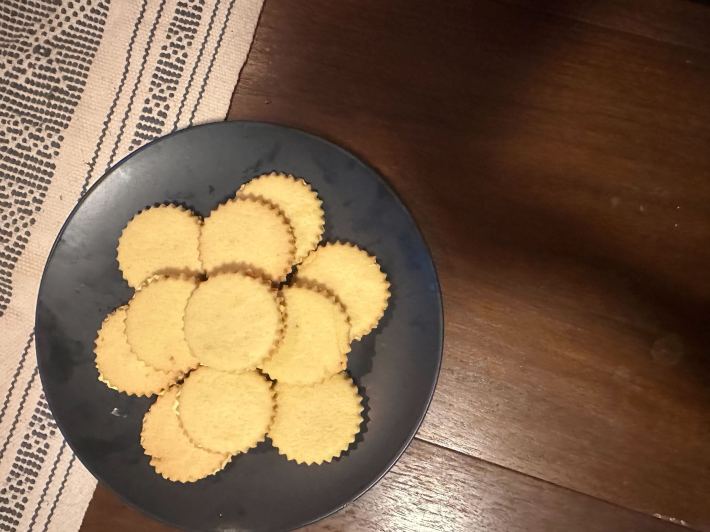 A plate of finished Custard Cream cookies, shown from the top.
