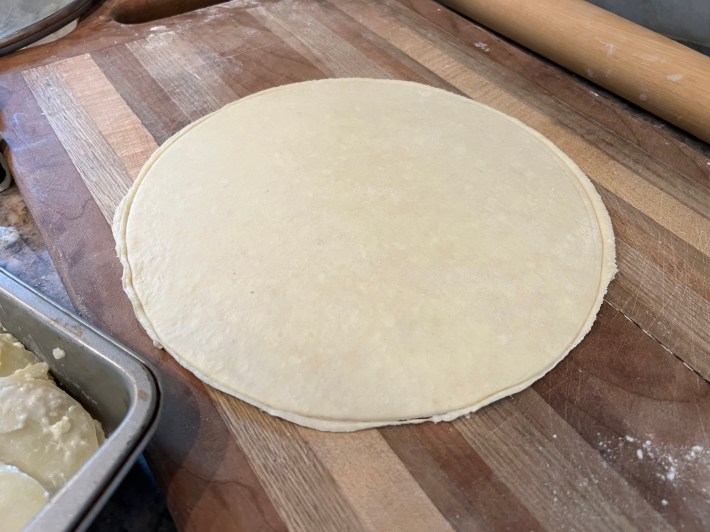 A flat circle of pastry dough.