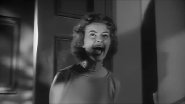 Actress Carolyn Craig screams in terror in the role of Nora Manning.