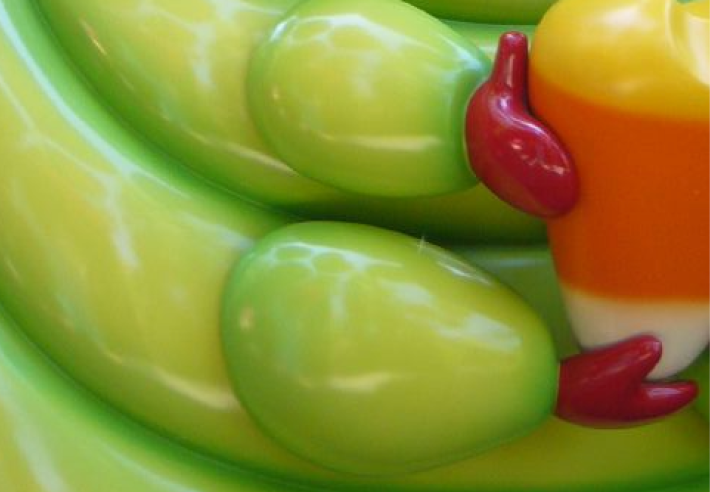 A close-up shot of the legs of a sculpture of Heimlich the caterpillar from A Bug's life