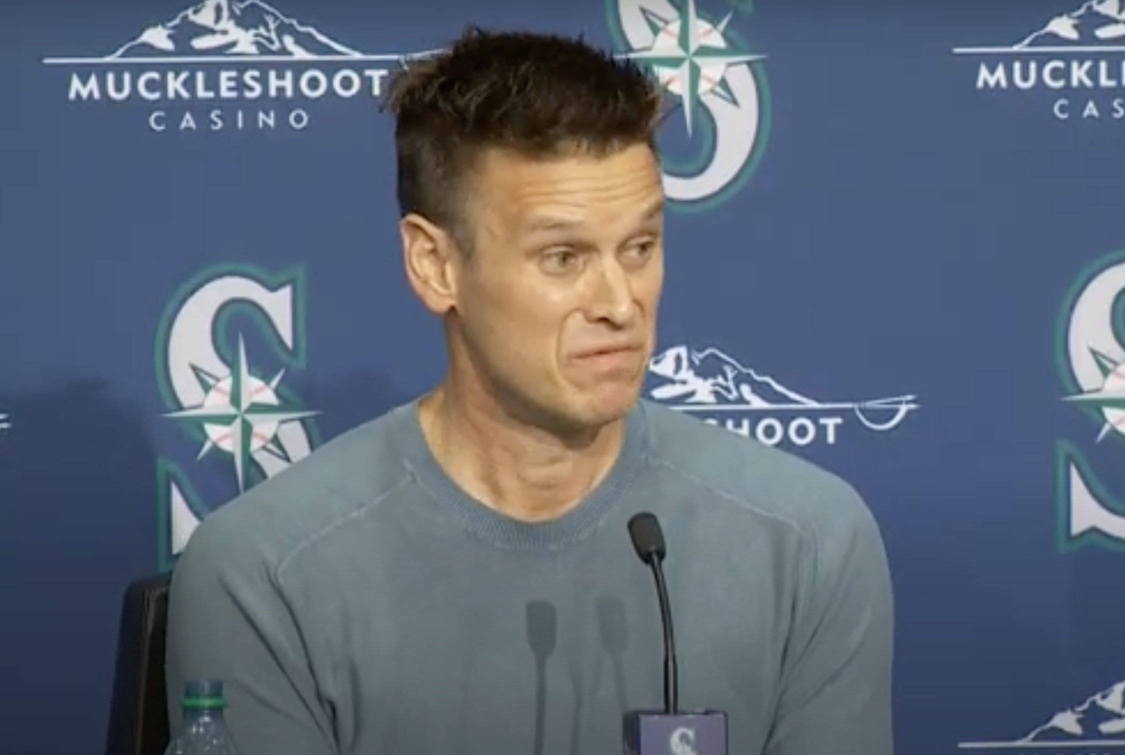 Jerry DiPoto makes a face while answering questions.