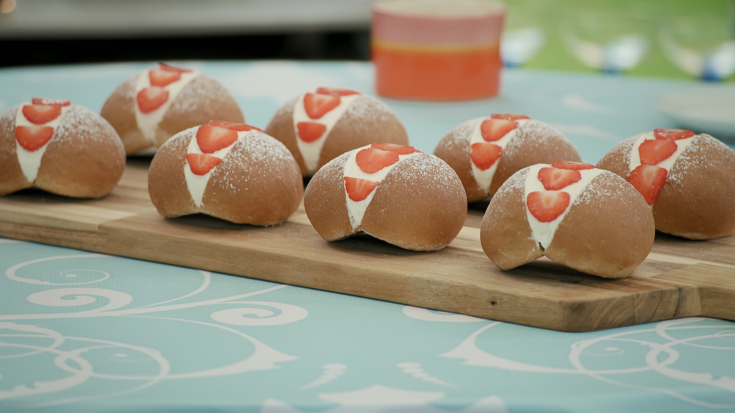 Paul Hollywood's Devonshire Splits, as shown on the Bread Week episode. They're very circular, very beautifully even in color, and very neatly decorated with cream and strawberries.