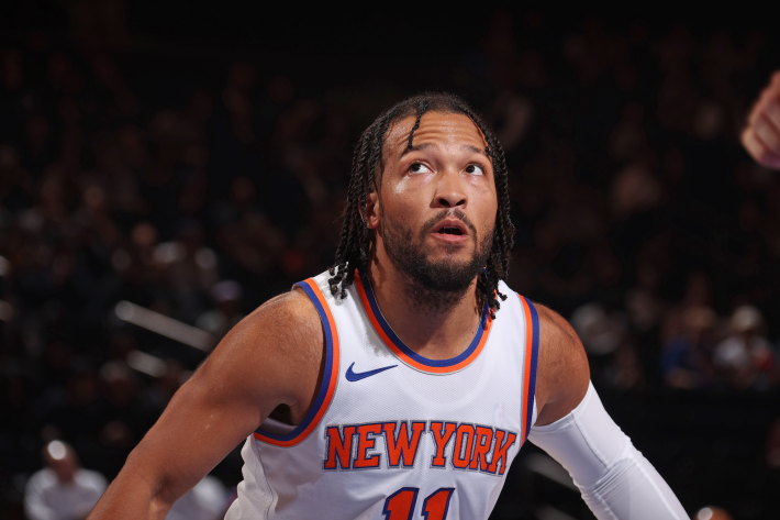 Jalen Brunson of the New York Knicks watches a ball in flight during a preseason game.