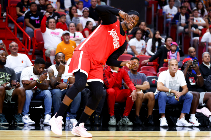 Jimmy Butler of the Miami Heat goofs off during a preseason charity-benefit game.