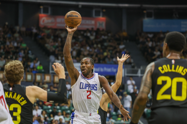 Kawhi Leonard of the Los Angeles Clippers attempts a floater shot against the Utah Jazz in a preseason game.