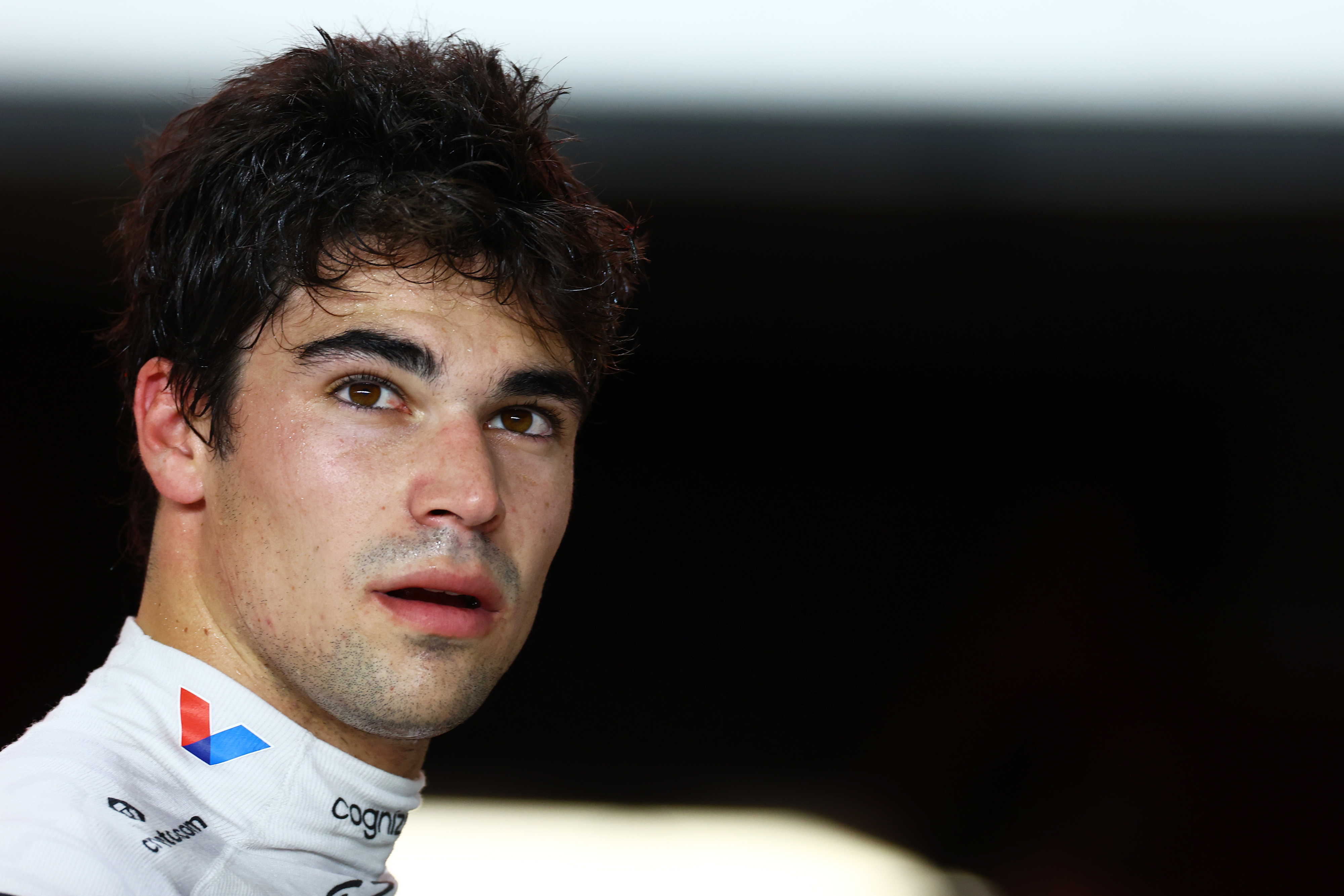 Lance Stroll of Canada and Aston Martin F1 Team looks on in the FIA garage during qualifying ahead of the F1 Grand Prix of Qatar.