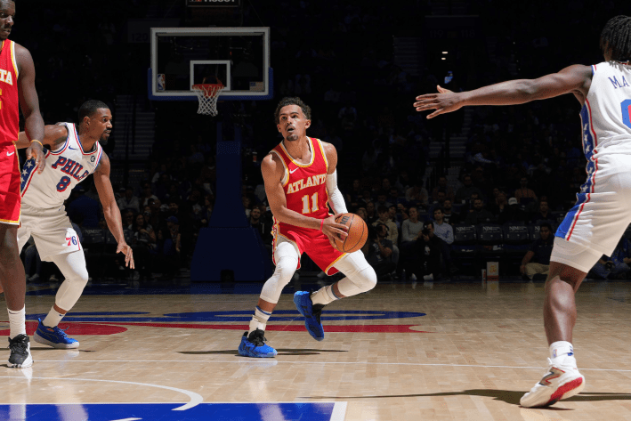 Trae Young of the Atlanta Hawks attempts a step-back three-pointer against the Philadelphia 76ers.