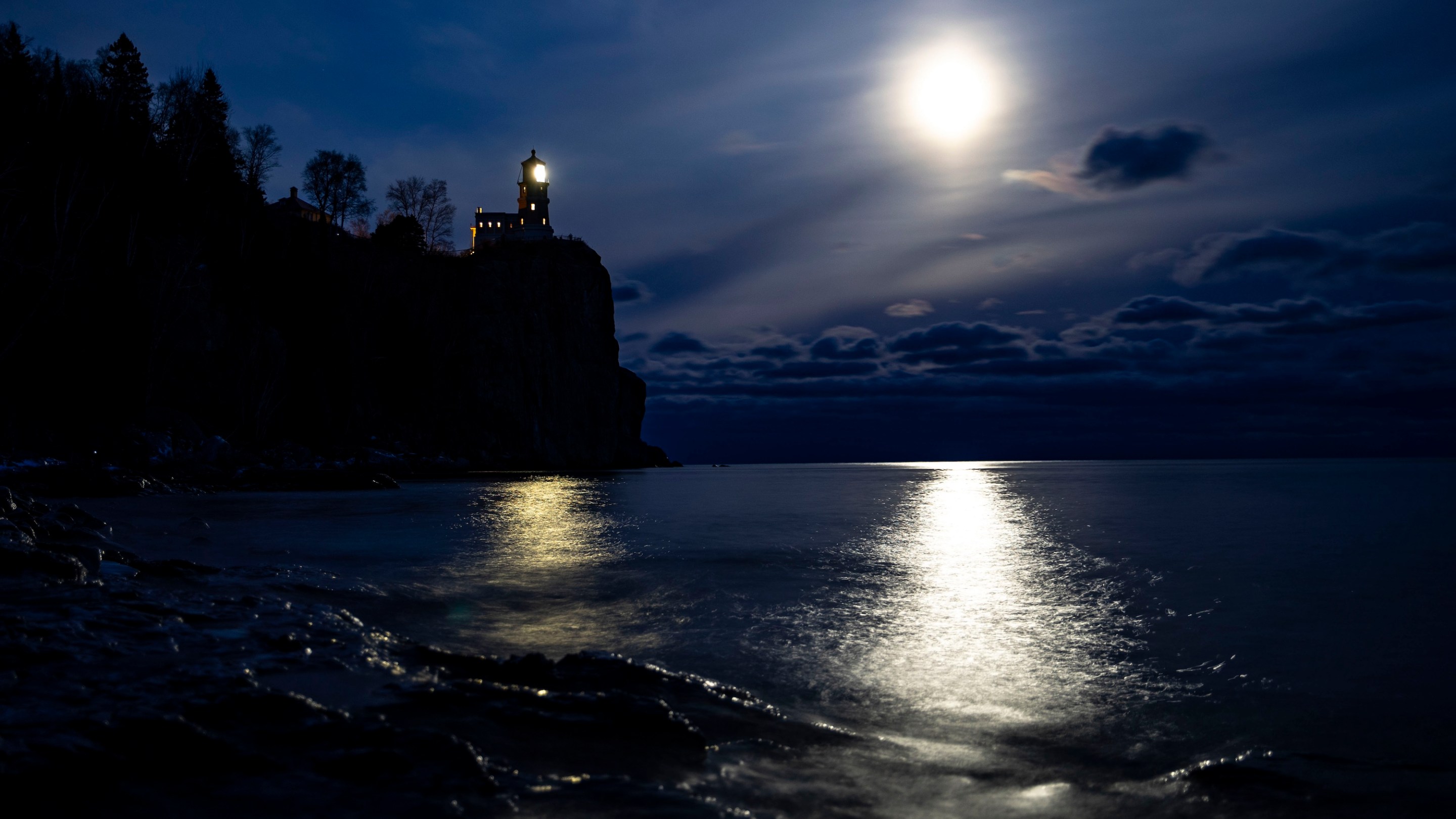 TWO HARBORS, MN - NOVEMBER 9: A bright moon shone over the horizon near the Split Rock Lighthouse on November 10, 2019. It was lit to honor the lives of the 29 men that died aboard the Edmund Fitzgerald 44 years ago. The lighthouse is only lit for approximately two hours and fifteen minutes each year. (Photo by Alex Kormann/Star Tribune via Getty Images)
