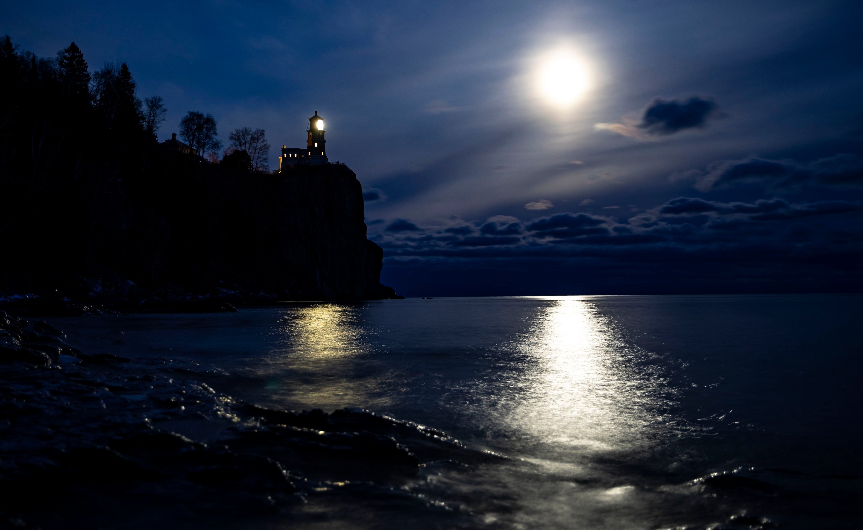TWO HARBORS, MN - NOVEMBER 9: A bright moon shone over the horizon near the Split Rock Lighthouse on November 10, 2019. It was lit to honor the lives of the 29 men that died aboard the Edmund Fitzgerald 44 years ago. The lighthouse is only lit for approximately two hours and fifteen minutes each year. (Photo by Alex Kormann/Star Tribune via Getty Images)