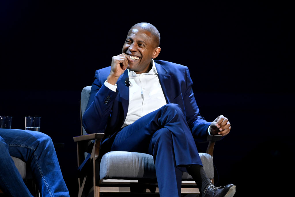 OZY Media founder Carlos Watson sitting onstage during a conversation at Carnegie Hall for an event by History Channel February 29, 2020 in New York City.