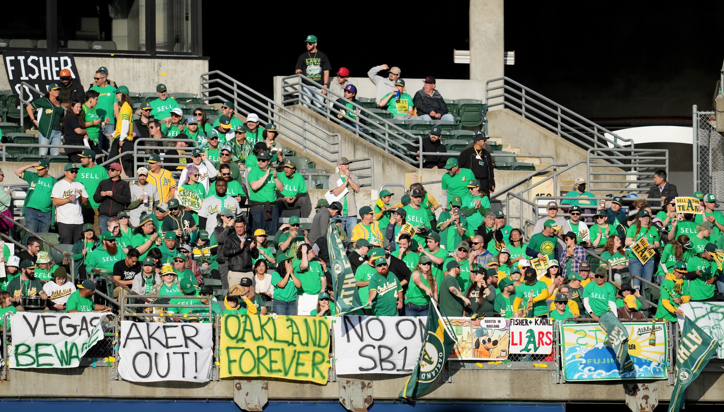 OAKLAND, CALIFORNIA - JUNE 13: Oakland Athletics fans display signs during a reverse boycott game against the Tampa Bay Rays at RingCentral Coliseum on June 13, 2023 in Oakland, California. (Photo by Brandon Vallance/Getty Images)