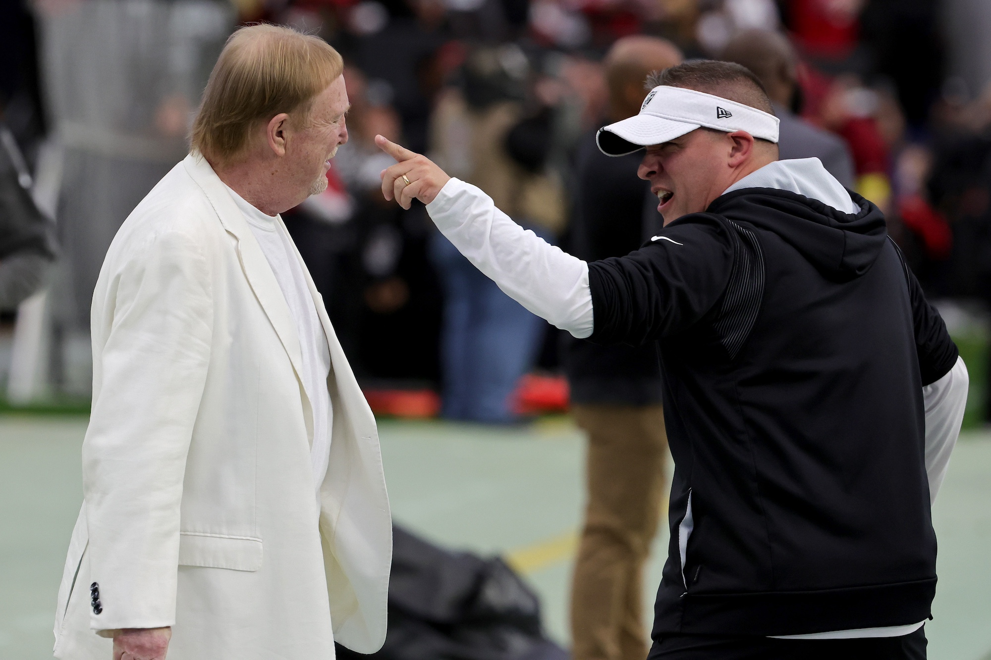 LAS VEGAS, NEVADA - JANUARY 01: Owner and managing general partner Mark Davis (L) of the Las Vegas Raiders talks with head coach Josh McDaniels on the Raiders' sideline before the team's game against the San Francisco 49ers at Allegiant Stadium on January 01, 2023 in Las Vegas, Nevada. (Photo by Ethan Miller/Getty Images)