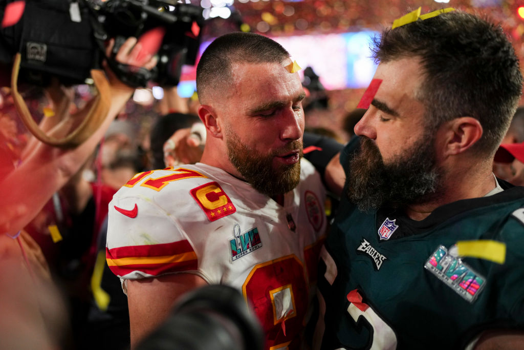 Travis Kelce #87 of the Kansas City Chiefs speaks with Jason Kelce #62 of the Philadelphia Eagles after Super Bowl LVII at State Farm Stadium on February 12, 2023 in Glendale, Arizona. The Chiefs defeated the Eagles 38-35.