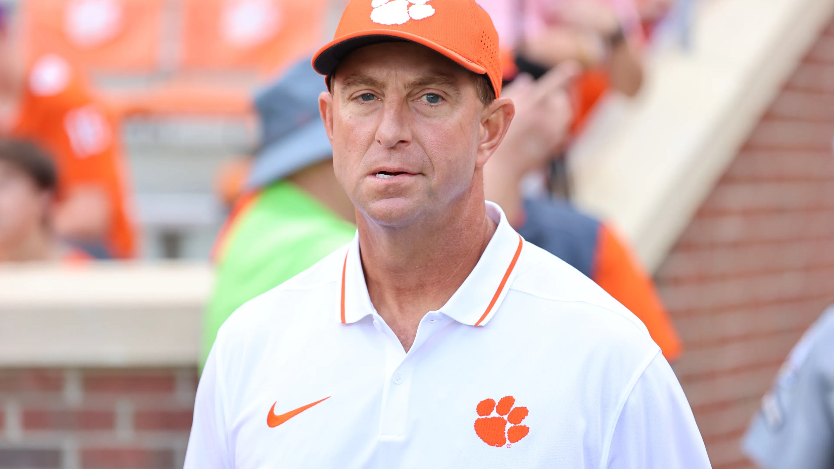 Head coach Dabo Swinney of Clemson Tigers takes the field during pregame against Charleston Southern Buccaneers at Memorial Stadium on September 9, 2023 in Clemson, South Carolina.