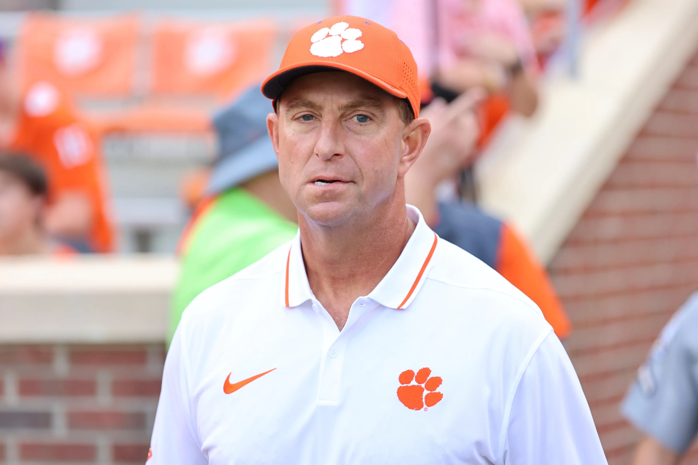 Head coach Dabo Swinney of Clemson Tigers takes the field during pregame against Charleston Southern Buccaneers at Memorial Stadium on September 9, 2023 in Clemson, South Carolina.