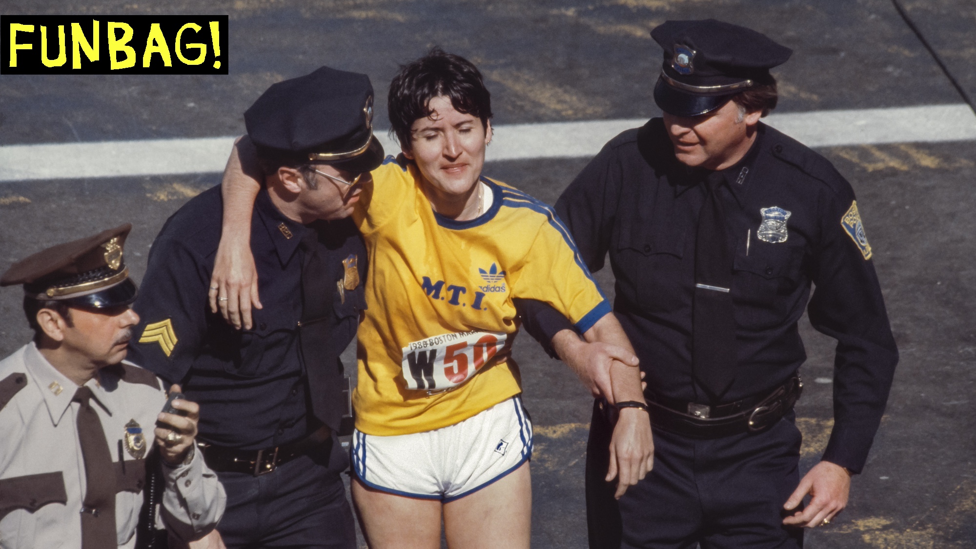 BOSTON - APRIL 21: Rosie Ruiz #W50 is supported by Boston police officers moments after crossing the finish line as the apparent women's race winner of the 84th Boston Marathon held on April 21, 1980 in Boston, Massachusetts. Ruiz was later stripped of her race title after it was determined she had not run the entire race. (Photo by David Madison/Getty Images) *** Local Caption *** Rosie Ruiz