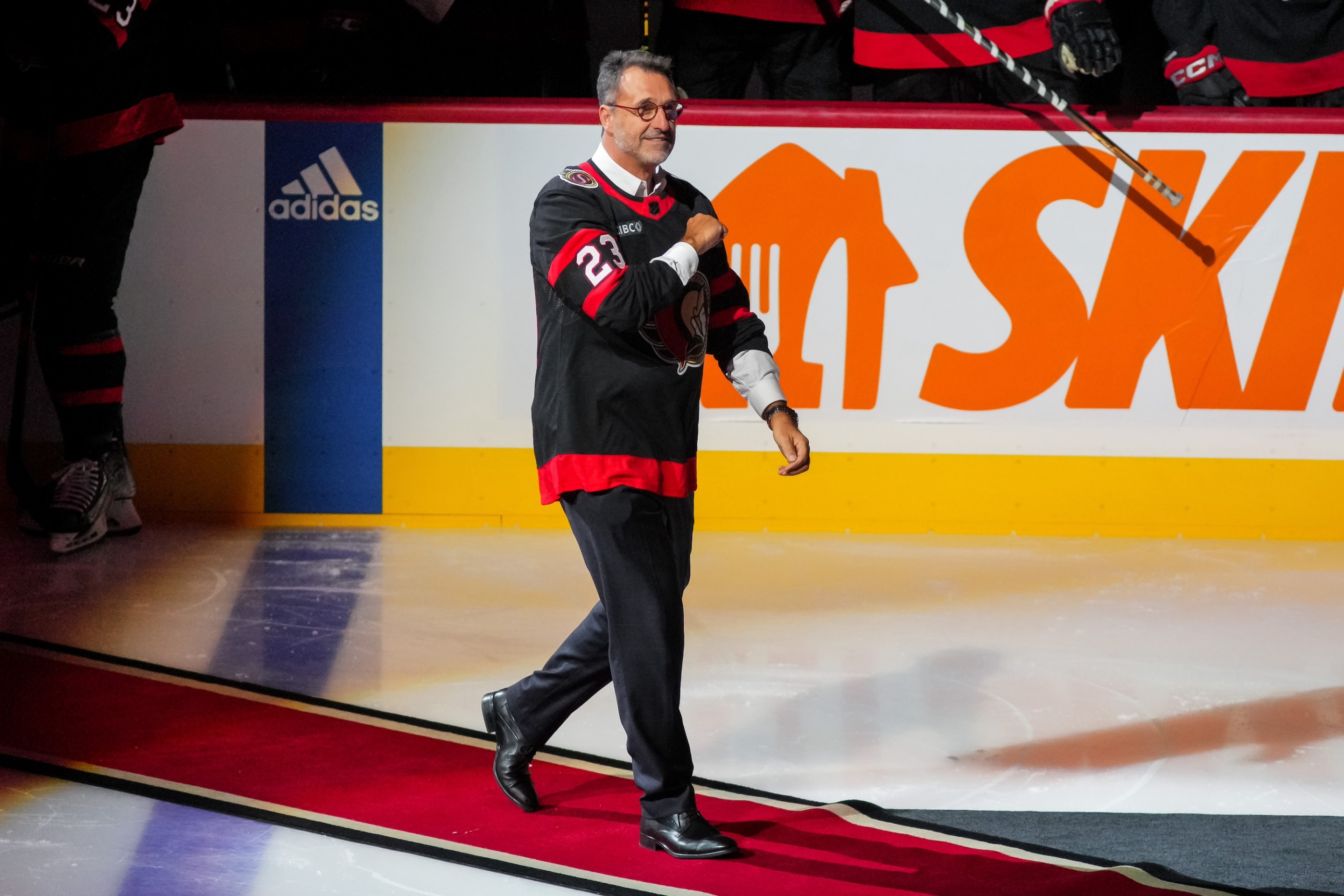 OTTAWA, CANADA - OCTOBER 14: Michael Andlauer new owner of the Ottawa Senators salutes the crowd as he walks out to give a face-off prior to a game against the Philadelphia Flyers at Canadian Tire Centre on October 14, 2023 in Ottawa, Ontario, Canada. (Photo by Chris Tanouye/Freestyle Photography/Getty Images)