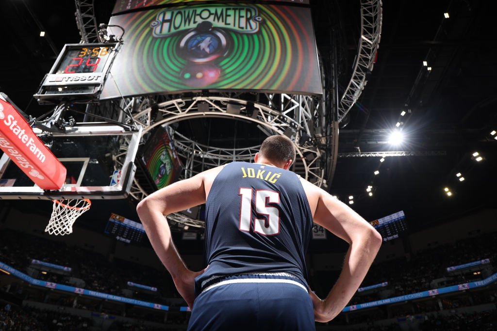 Nikola Jokic of the Denver Nuggets stands under the Jumbotron, which says "Howl-o-meter" during a stop in the game against the Minnesota Timberwolves on November 1, 2023 at Target Center in Minneapolis, Minnesota.