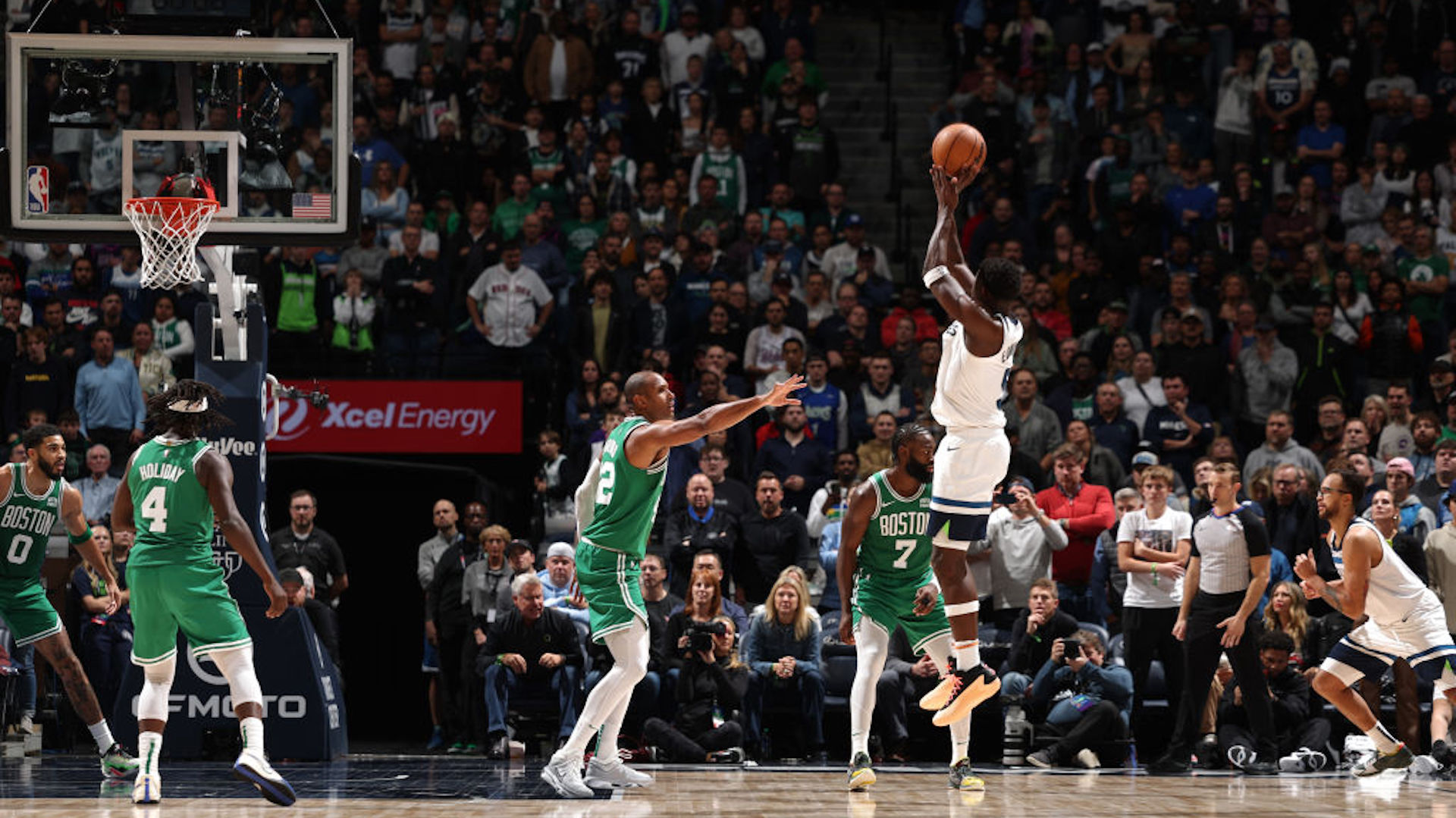 Anthony Edwards #5 of the Minnesota Timberwolves shoots a three point basket during overtime against the Boston Celtics on November 6, 2023 at Target Center in Minneapolis, Minnesota.