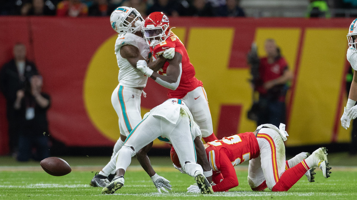 Tyreek Hill of Miami Dolphins and Trent McDuffie of Kansas City Chiefs battle for the ball during the NFL match between Miami Dolphins and Kansas City Chiefs at Deutsche Bank Park on November 5, 2023 in Frankfurt am Main, Germany.