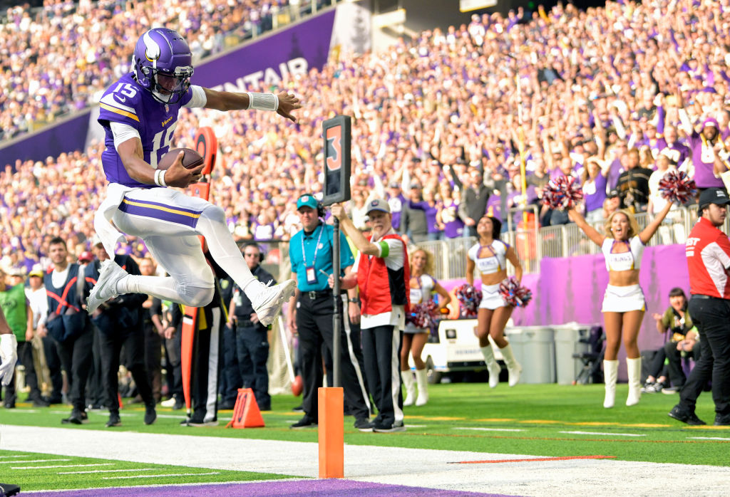 Joshua Dobbs leaps into the end zone at the end of a run