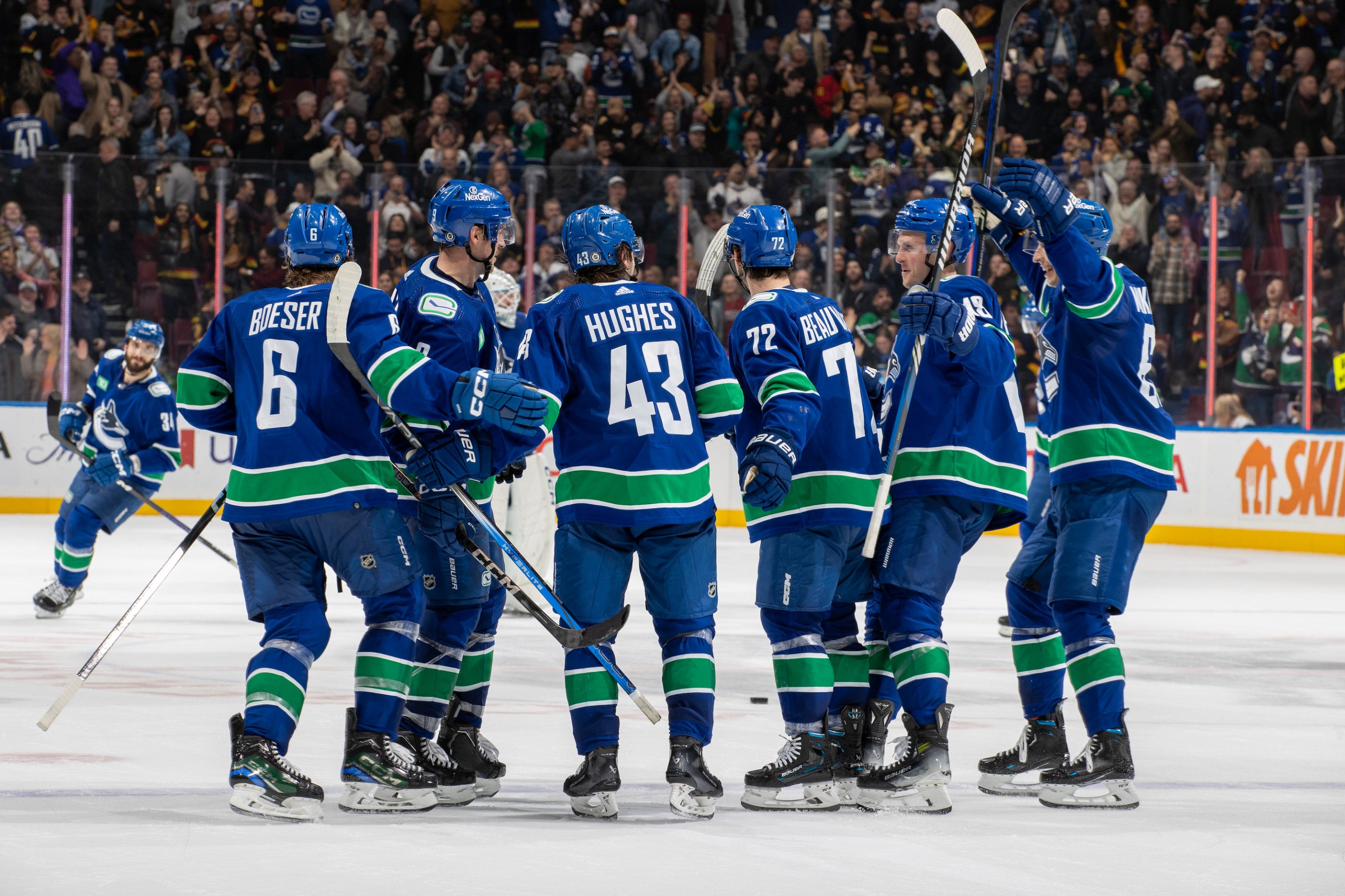 Quinn Hughes #43 of the Vancouver Canucks celebrates his goal with teammates after their overtime NHL game against the New York Islanders at Rogers Arena on November 15, 2023 in Vancouver, British Columbia, Canada.