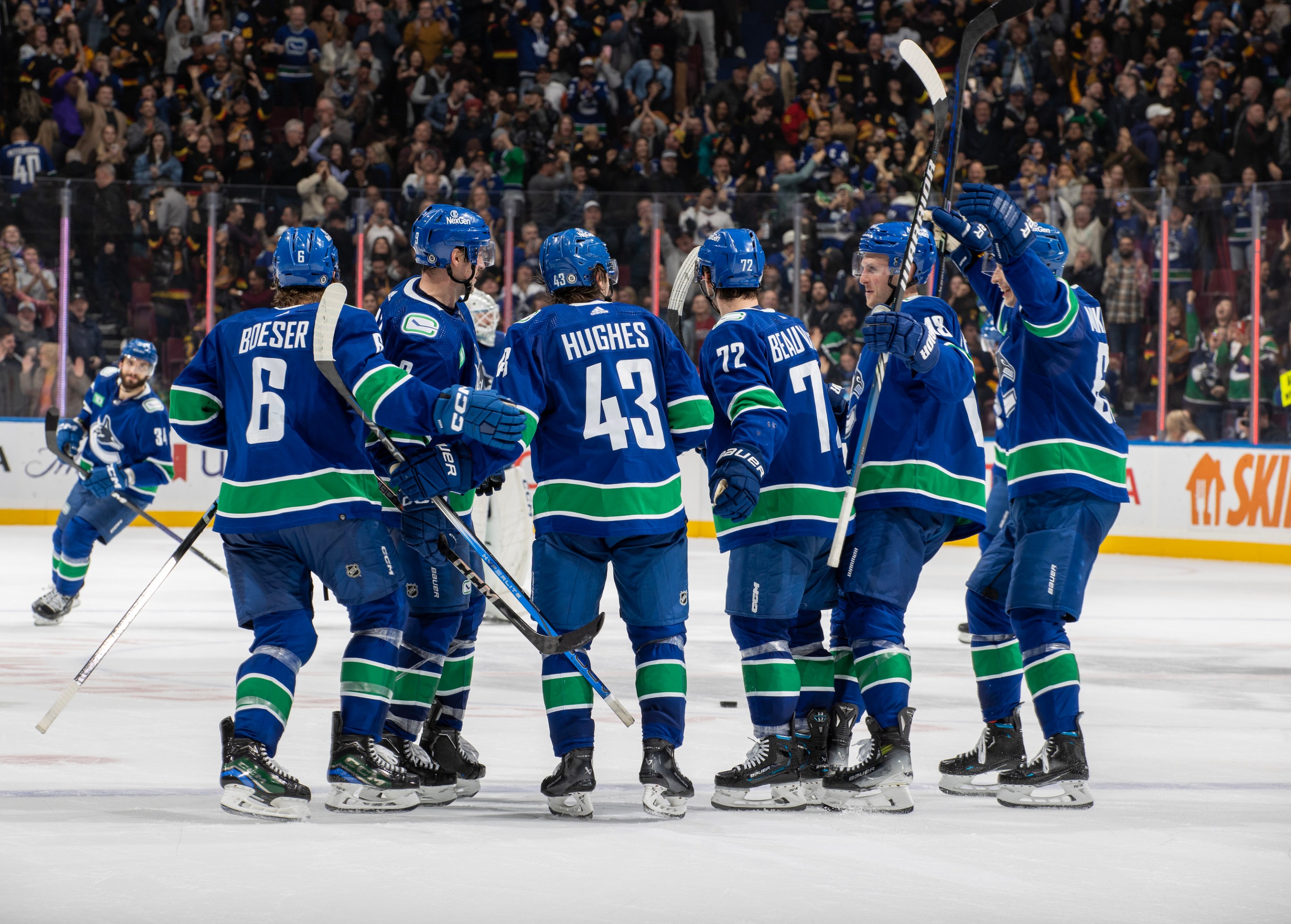 Quinn Hughes #43 of the Vancouver Canucks celebrates his goal with teammates after their overtime NHL game against the New York Islanders at Rogers Arena on November 15, 2023 in Vancouver, British Columbia, Canada.