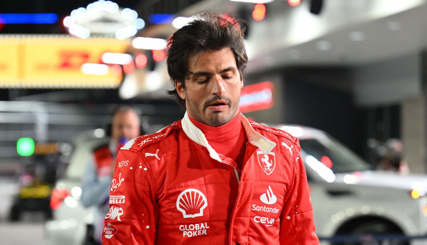 Ferrari's Spanish driver Carlos Sainz Jr., returns to the pit after an accident during the first practice session for the Las Vegas Formula One Grand Prix on November 16, 2023, in Las Vegas, Nevada. Race stewards cancelled the practice after the accident to inspect the track. The session was cut short after around ten minutes due to a loose drain cover, according to FIA officials. (Photo by ANGELA WEISS / AFP) (Photo by ANGELA WEISS/AFP via Getty Images)