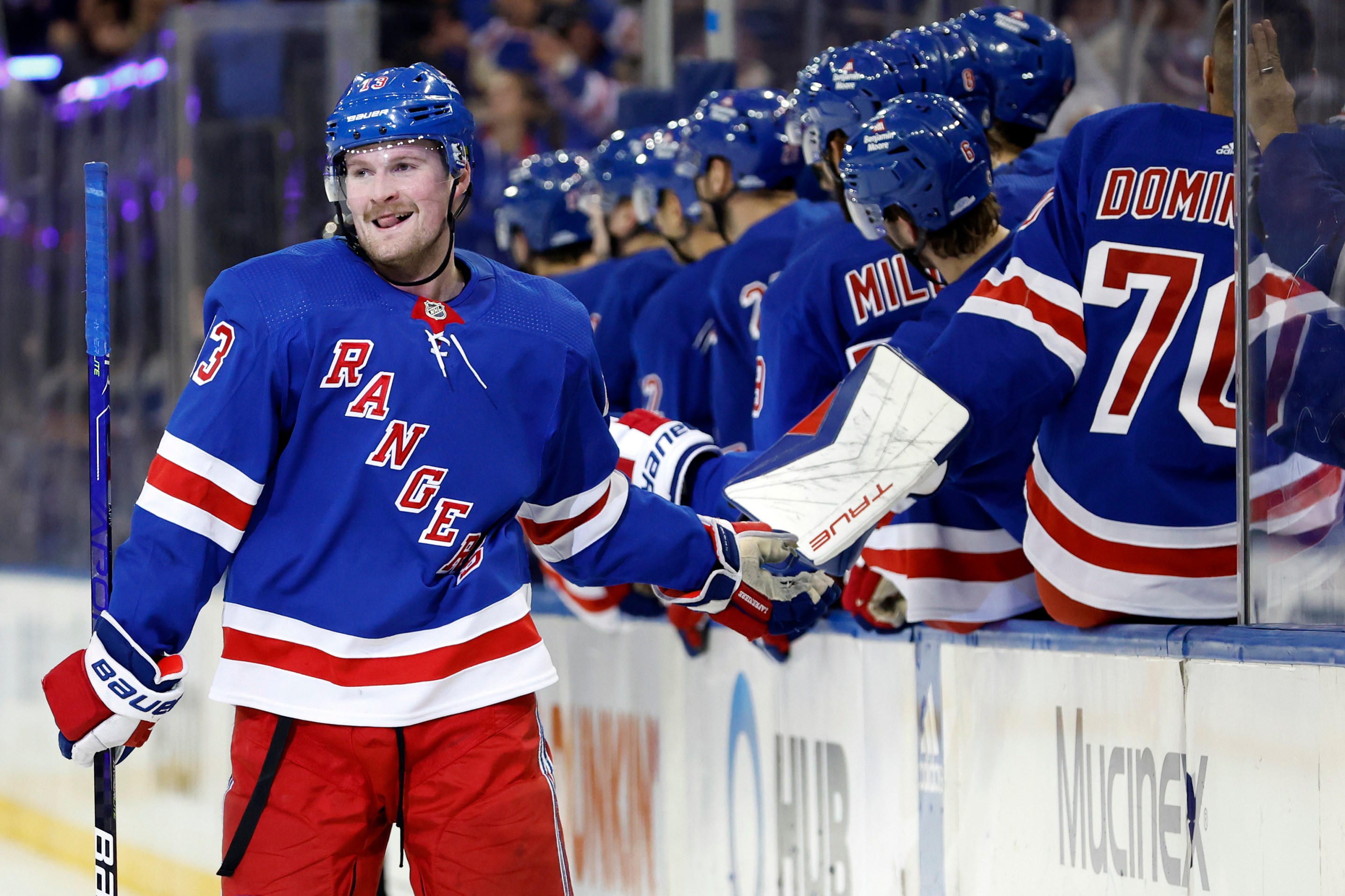 NEW YORK, NEW YORK - NOVEMBER 12: Alexis Lafreniere #13 of the New York Rangers celebrates with the bench after scoring a game-tying goal during the third period against the Columbus Blue Jackets at Madison Square Garden on November 12, 2023 in New York City. The New York Rangers won 4-3 in a shootout. (Photo by Sarah Stier/Getty Images)