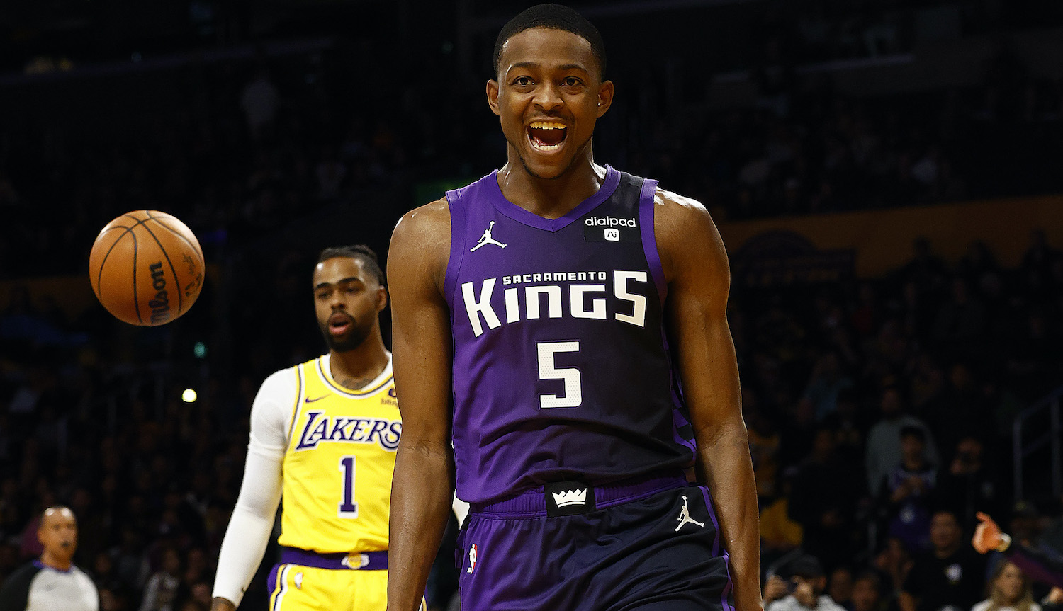 LOS ANGELES, CALIFORNIA - NOVEMBER 15: De'Aaron Fox #5 of the Sacramento Kings after fouled by D'Angelo Russell #1 of the Los Angeles Lakersin the first quarter at Crypto.com Arena on November 15, 2023 in Los Angeles, California. NOTE TO USER: User expressly acknowledges and agrees that, by downloading and/or using this photograph, user is consenting to the terms and conditions of the Getty Images License Agreement. (Photo by Ronald Martinez/Getty Images)