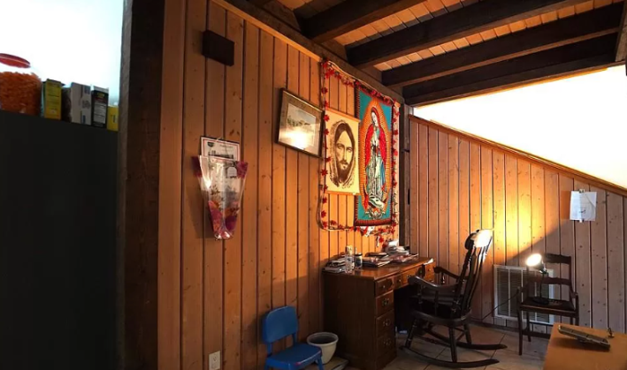 wood panneled walls with jesus art