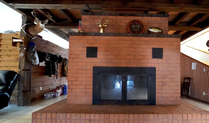 a fireplace with a deep head lurking