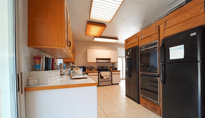 narrow kitchen with strange box lights