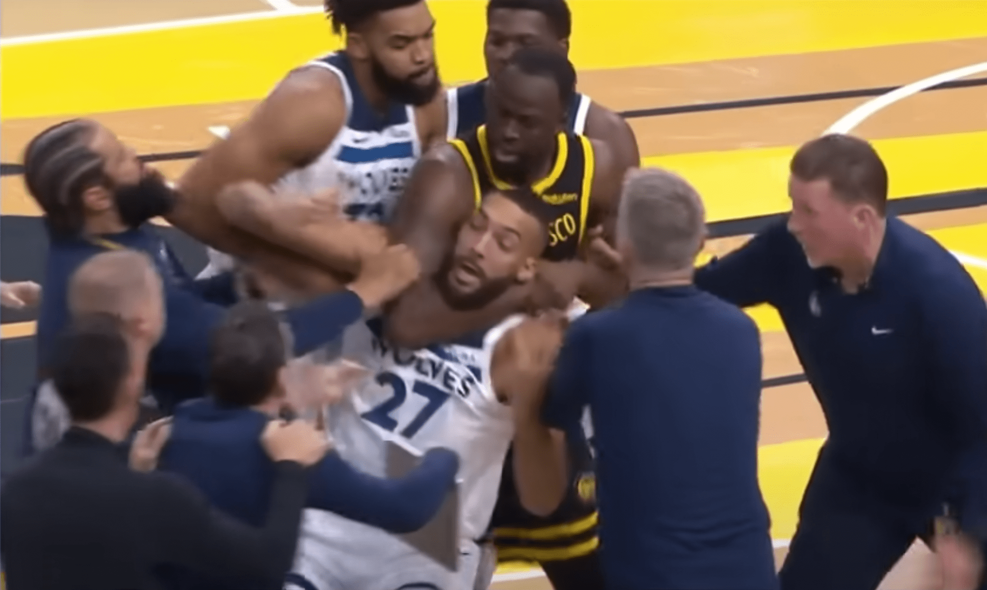 Draymond Green puts Rudy Gobert in a chokehold.