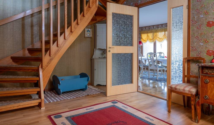 entry way with curved wooden stairs