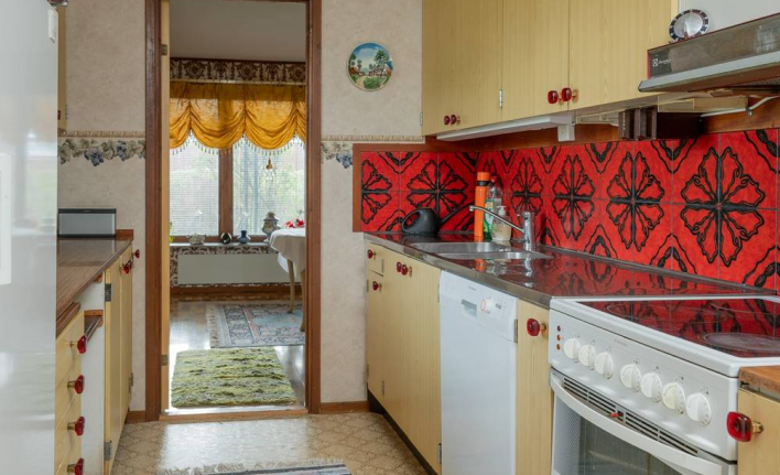 kitchen with bright red tiles