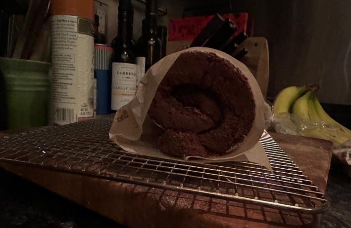 A sponge cake rolled up