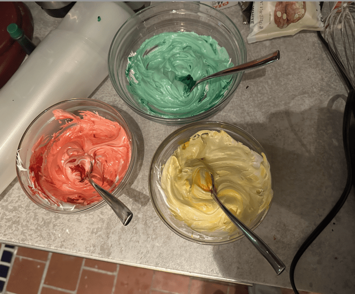 Three colored Swiss meringues.