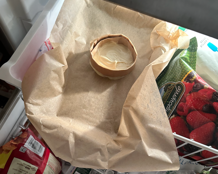 A white chocolate circle in the freezer.