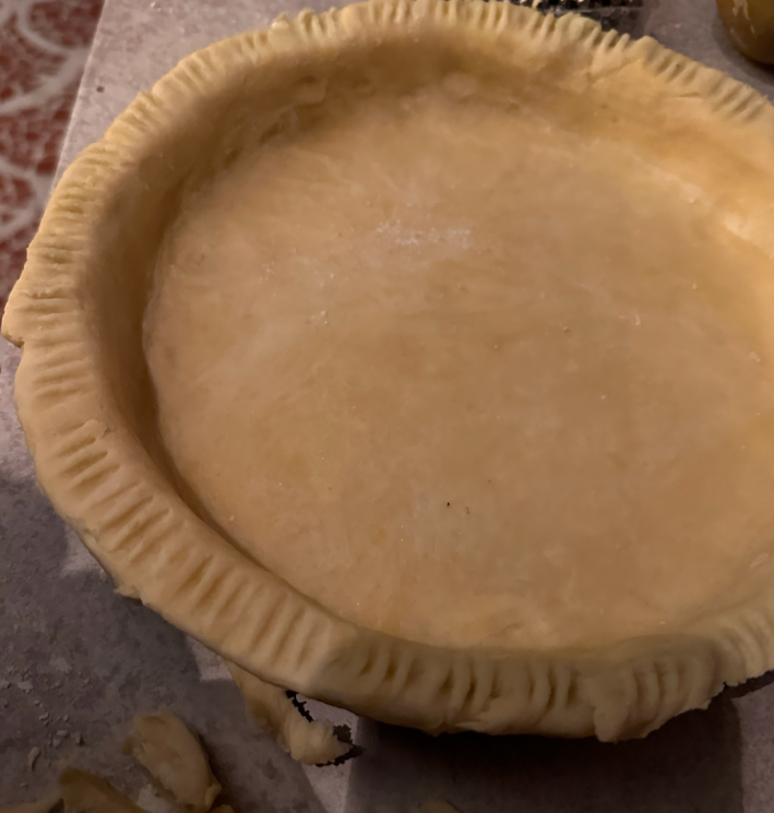 Raw pie dough in a tin