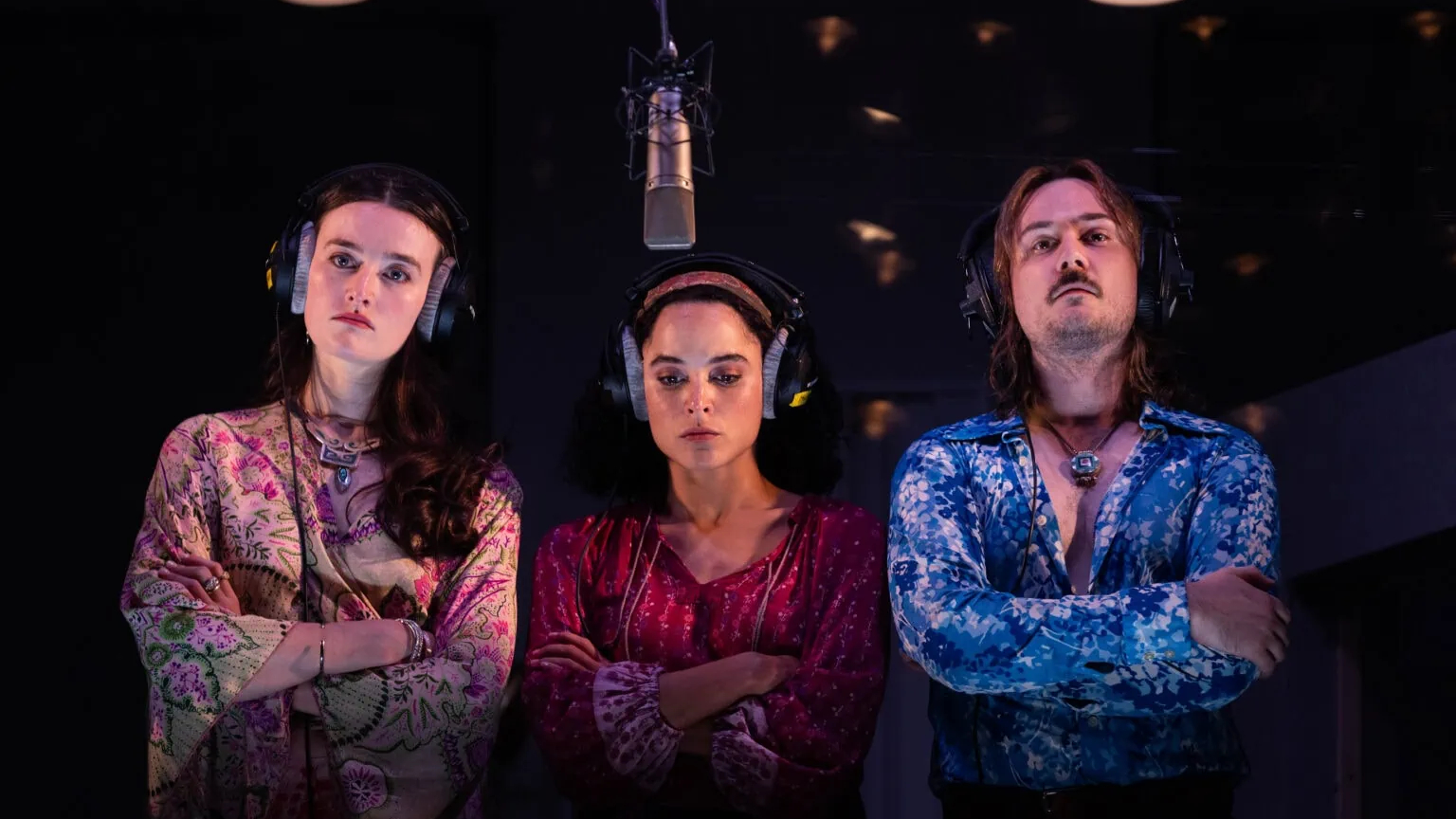 three members of the Stereophonic cast in a recording booth
