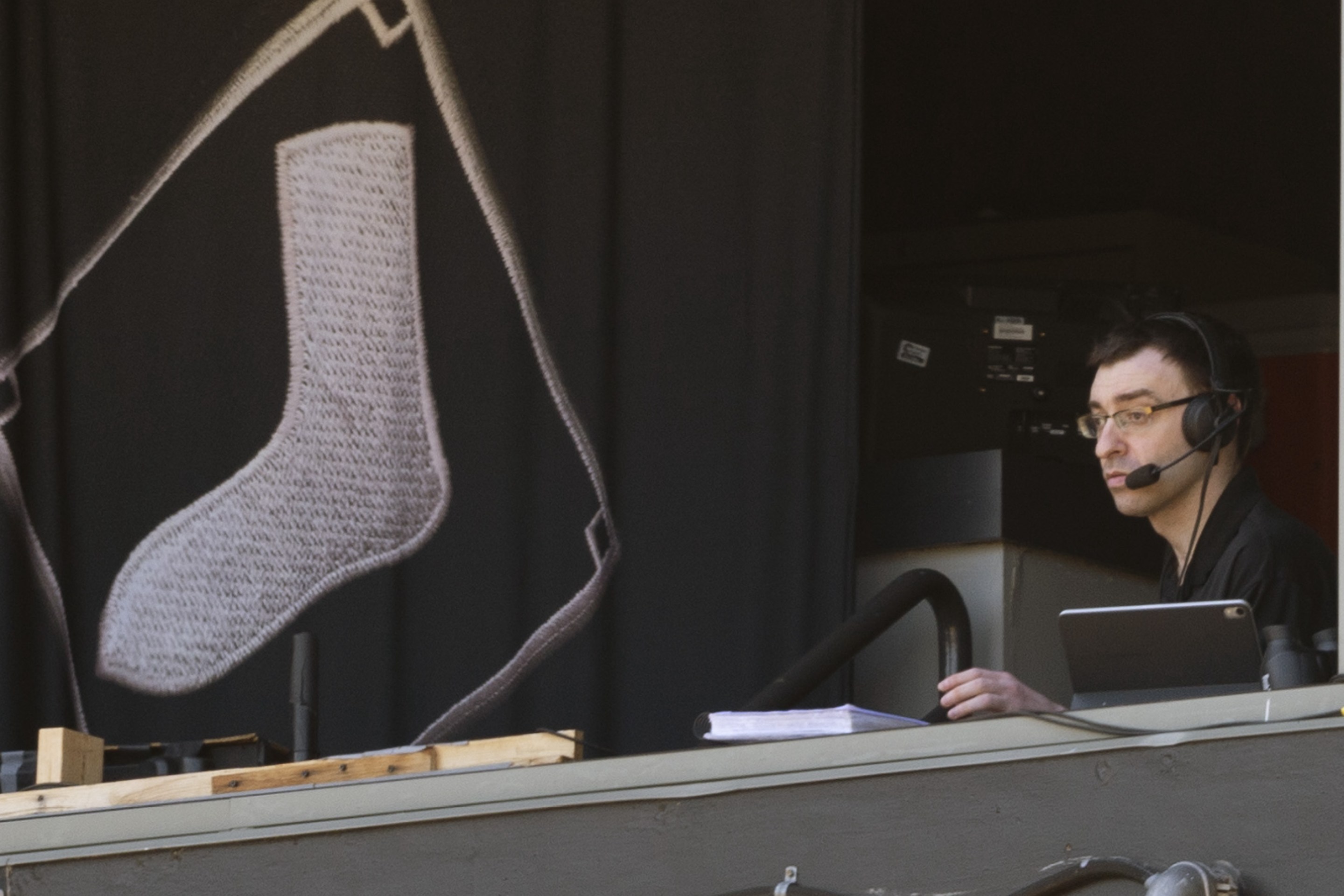 Jason Benetti looks on from the White Sox broadcasting booth.