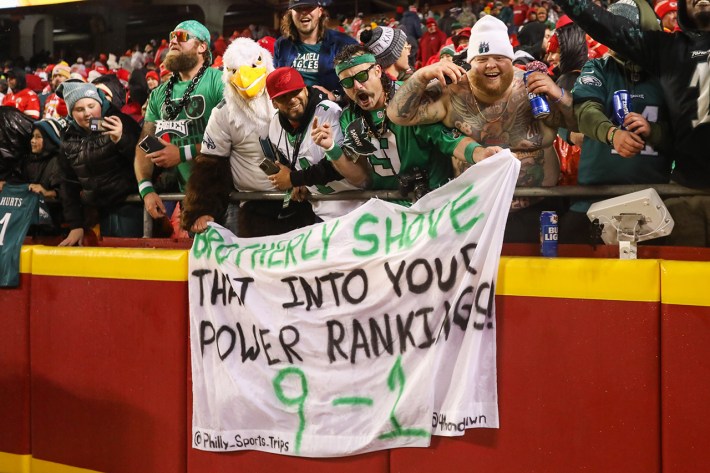 KANSAS CITY, MO - NOVEMBER 20: Philadelphia Eagles fan hold a sign that says “Brotherly Shove that into your Power Rankings 9-1” after an NFL football game between the Philadelphia Eagles and Kansas City Chiefs on Nov 20, 2023 at GEHA Field at Arrowhead Stadium in Kansas City, Missouri.