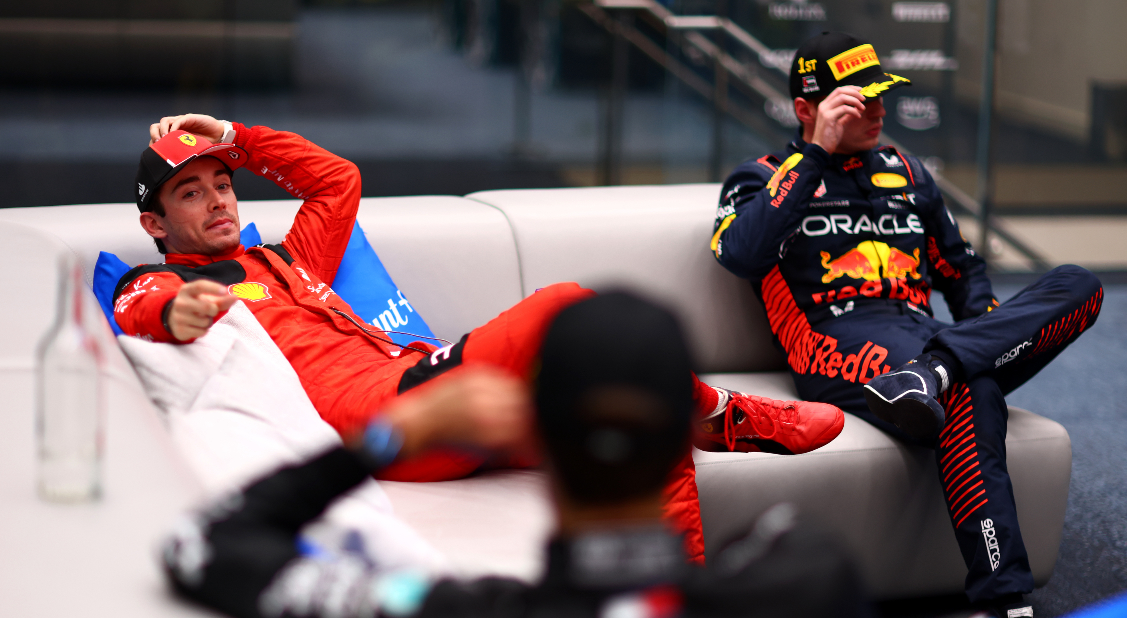 Charles Leclerc talks to George Russell in the cool down room during the F1 Grand Prix of Abu Dhabi.