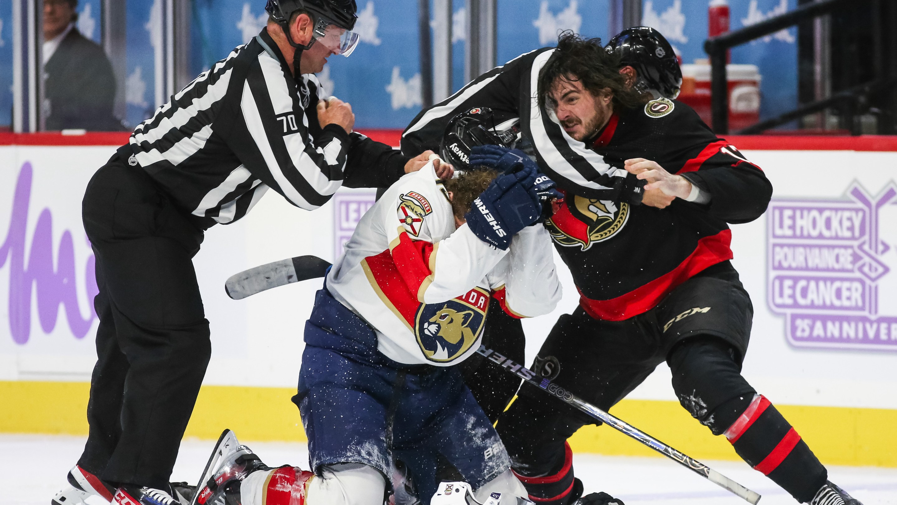 Matthew Tkachuk #19 of the Florida Panthers protects himself from Zack MacEwen #17 of the Ottawa Senators during the third period at Canadian Tire Centre on November 27, 2023.